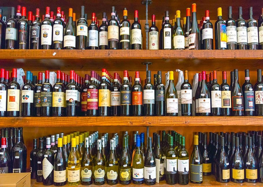 Why are wine bottles usually made of glass?